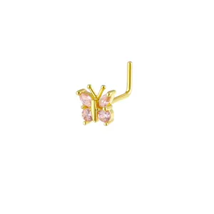 Detailed macro view of an L-shaped nose stud featuring a pink zircon butterfly design