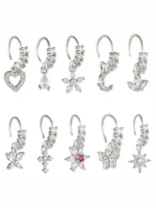 Detailed set of silver nose rings with clear zircon heart, butterfly, and cross charms
