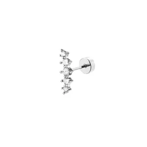 Macro detail of stainless steel cartilage earring with five graduated clear zircons