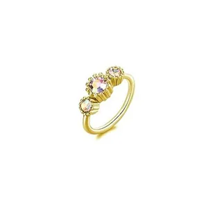 Adjustable gold copper nose ring featuring three shimmering AB iridescent cubic zirconia