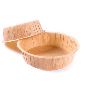 Détail de moules en papier sulfurisé ronds pour la cuisson de gâteaux, couleur naturelle