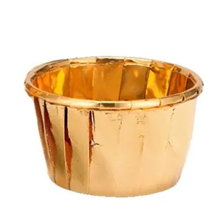 Glossy gold aluminum foil cupcake liners with rolled edges for muffins and baking