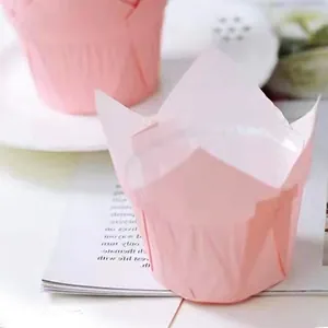 Close-up of pink tulip-shaped greaseproof paper liners for baking muffins and cupcakes