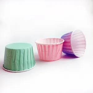 Macro detail of tulip muffin paper cups in mint green, pink, and purple gradient