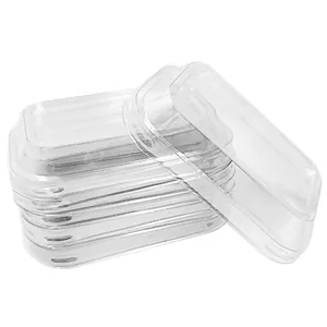 Stack of 5 rectangular transparent plastic cake box lids with rounded corners