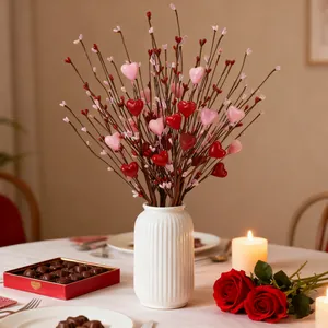 Valentine heart branches bouquet in a white ceramic vase for romantic home table decor