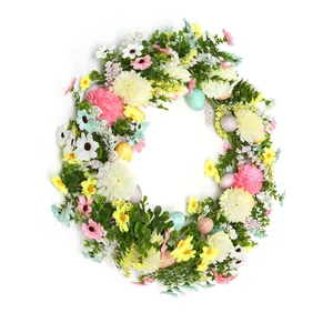Detailed close-up of Easter wreath with daisies, colorful eggs, and green eucalyptus leaves