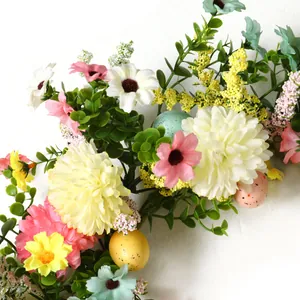 Macro detail of Easter wreath featuring colorful eggs, daisies, and eucalyptus leaves