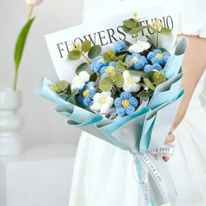 Detail of hand-knitted blue rose bouquet with Just For You ribbon and white gift card