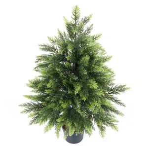 Detailed view of artificial Christmas tree in black plastic pot with green PVC needles