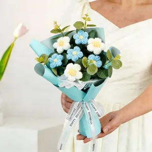 Handheld crochet sunflower bouquet with Happy Birthday ribbon in blue paper wrap