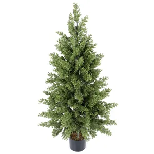 Detailed close-up of realistic Norfolk Pine artificial tree in a black minimalist pot