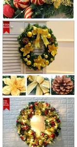 Close-up of golden Christmas wreath with LED lights, silk flowers and pine cones
