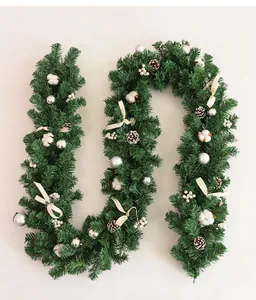 Close-up of 2.7m Christmas garland with pine cones, silver baubles, and cotton flowers