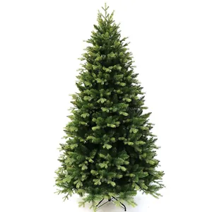 Detailed close-up of dense green PE needles on a realistic artificial Christmas tree