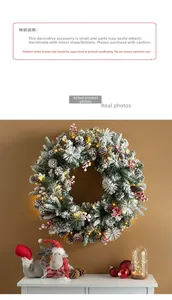 Close-up of a 75cm flocked Christmas wreath with warm LED lights, red berries and pine cones