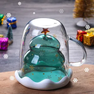 Insulated double wall glass mug with green Christmas tree shape and golden star