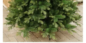 Sturdy foldable metal base and dense green pine needles of artificial Christmas tree