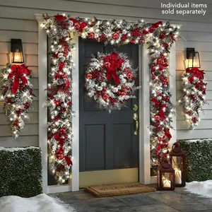 Detail of red and silver Christmas wreath with LED lights, bows and pinecones