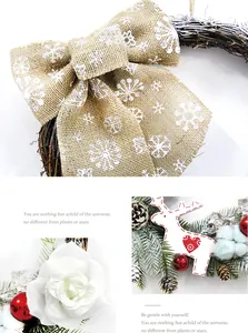 Detail of Christmas wreath with snowflake jute bow, pine cones and white reindeer charm