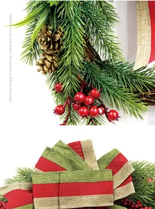 Detailed close-up of Christmas wreath showing pine cones, berries, and a striped burlap bow