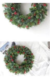 Close-up of 60cm frosted cedar Christmas wreath with red berries, pine cones and LED lights