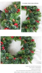 Detailed view of 60cm frosted Christmas wreath with pine cones, red berries and LED lights