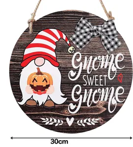 Detail of 30cm wooden gnome sweet gnome door sign with seasonal pumpkin and buffalo plaid bow