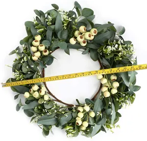 Macro shot showing 22-inch outer diameter of artificial eucalyptus wreath with berries