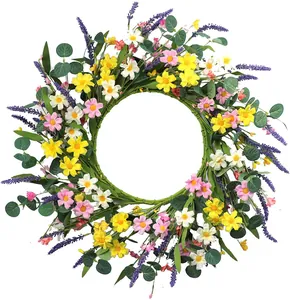 Macro shot of artificial eucalyptus wreath with yellow daisies and lavender details