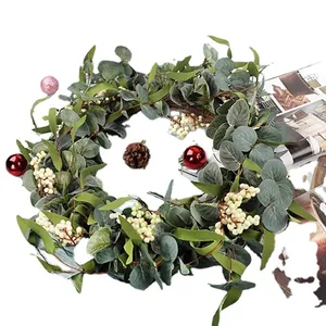 Artificial eucalyptus wreath with pine cones and berries for garden door decoration