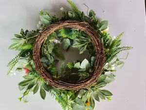 Detail of handcrafted Easter wreath featuring mixed artificial flowers on a rattan base