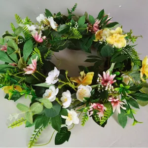 Handmade spring floral wreath with daisy flowers and eucalyptus leaves for home door decor