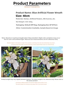 Detail of 40cm blue artificial floral wreath with silver bow and natural vine base