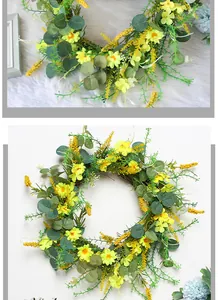 Detailed view of artificial spring wreath with yellow daisies and eucalyptus leaves