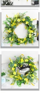 Detail of a floral wreath with yellow daisies, eucalyptus leaves and green foliage on white fur