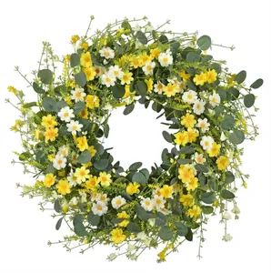 Close-up of a 45cm spring wreath featuring yellow daisies and eucalyptus green leaves
