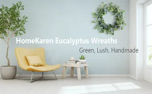 Close-up of lush handmade eucalyptus leaf wreath on a minimalist blue interior wall