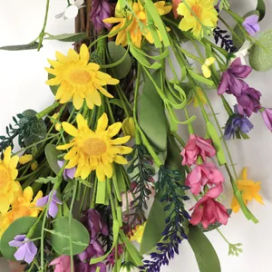 Vibrant 55cm floral wreath with yellow sunflowers and lavender on a natural rattan base