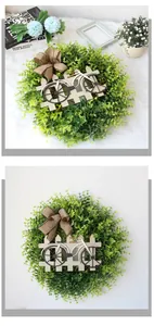 Detail of artificial daisy wreath with wooden bicycle insert and burlap bow decoration