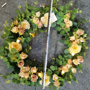 Detail of 48cm lighted rose eucalyptus wreath with measuring tape showing actual size