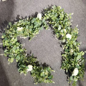 Artificial eucalyptus vine with white roses for wedding decor and home floral styling