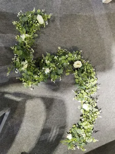 Artificial eucalyptus vine with white roses and berries for wedding arch decoration