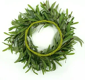 Close-up of olive leaf wreath showing realistic two-tone leaves and green olives details