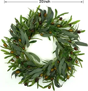 Detailed view of a 20-inch artificial olive wreath with realistic leaves and green fruits