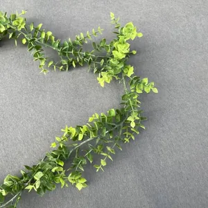 Detailed texture of green artificial eucalyptus vine leaves for wedding home decoration