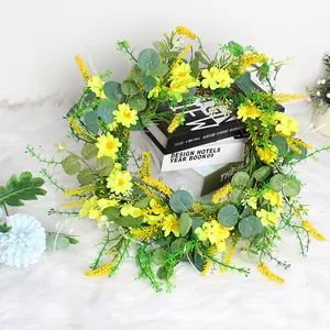 Artificial spring daisy and eucalyptus leaf wreath for home and festive decoration