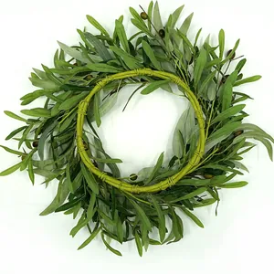 Artificial olive branch wreath with realistic green leaves and black purple fruits on white background