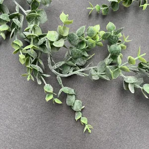 Detailed view of artificial frosted eucalyptus vine with natural grey-green leaves