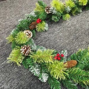 2.7m Christmas garland with pine needles, red berries, and snow-tipped pine cones